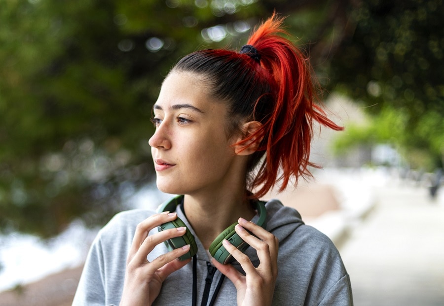 beach hairstyle with red ponytail