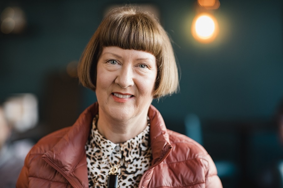 older woman with short bob and bangs