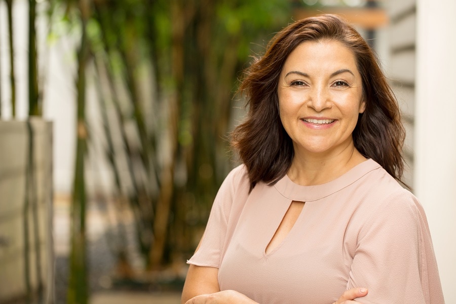 woman over 50 with brunette hairstyle