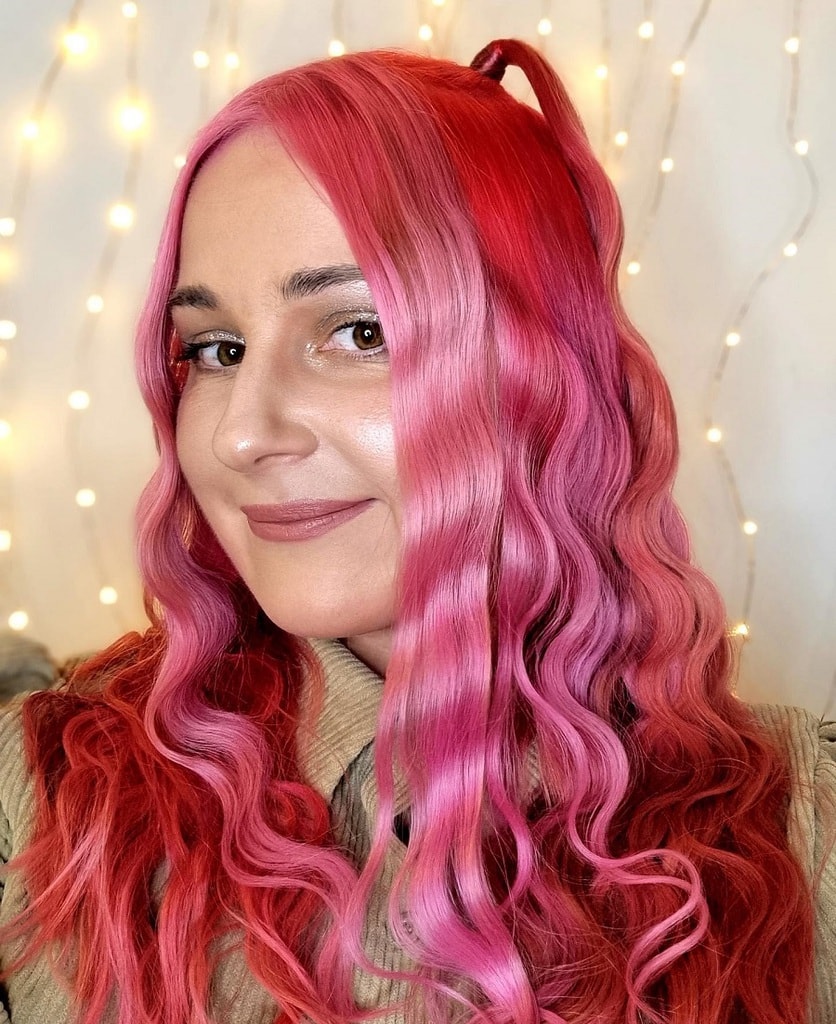 curly half updo with bright red hair