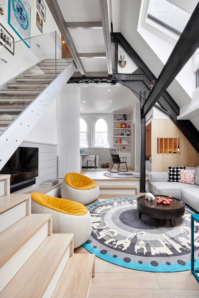 modern interior with view of double height living room with slanted ceiling