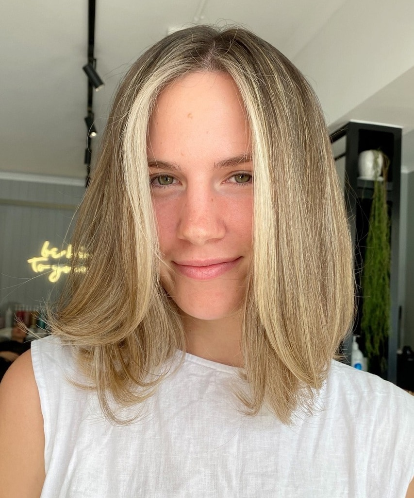 long blonde bob with face framing highlights