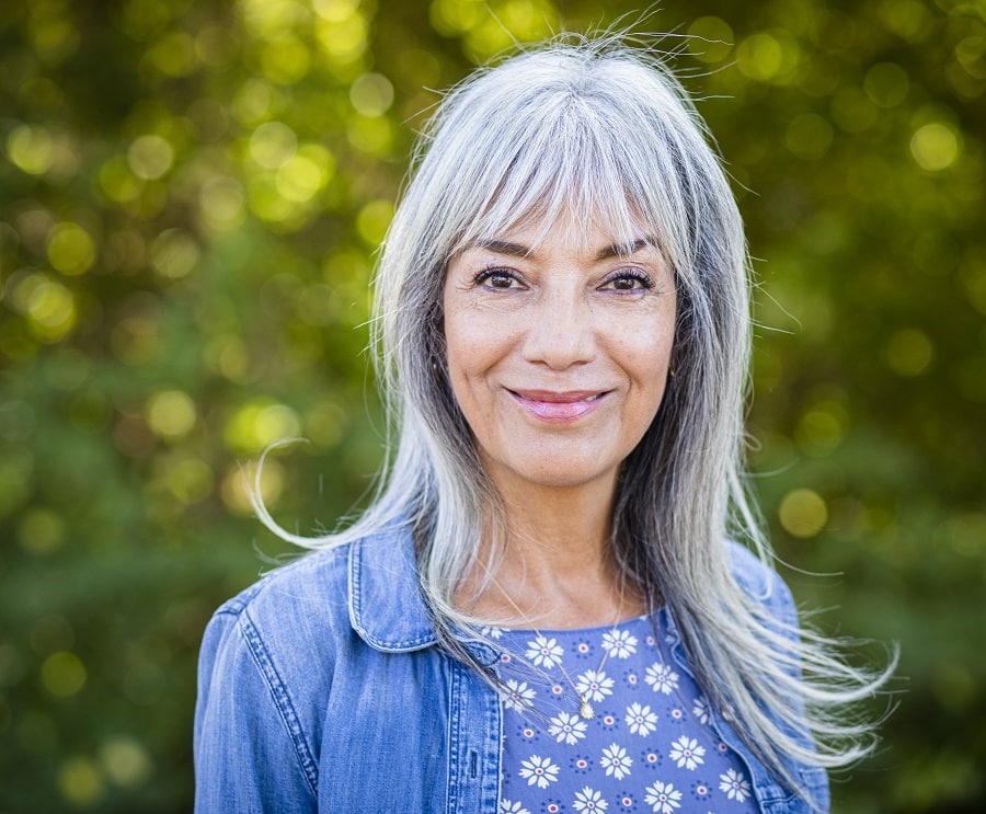 medium gray hairstyle with bangs for women over 50