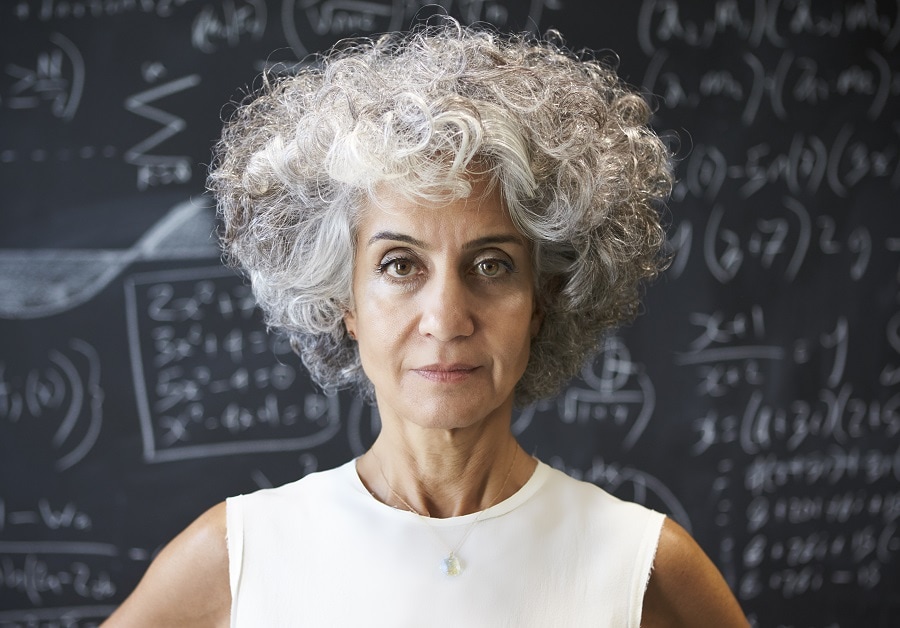 older woman with curly gray hairstyle