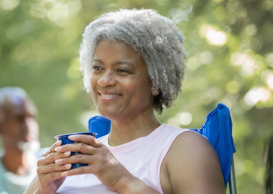 black woman over 50 with afro gray hair