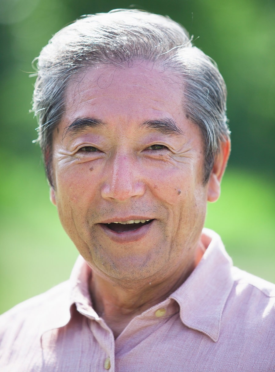 older Asian man with short hair