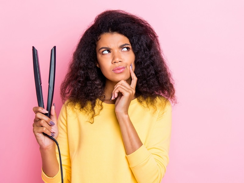 reasons why curly hair get frizzy after straightening