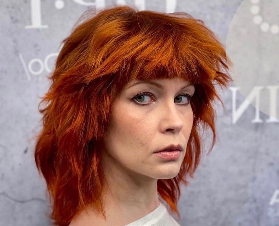 copper red shaggy hairstyle for woman over 50