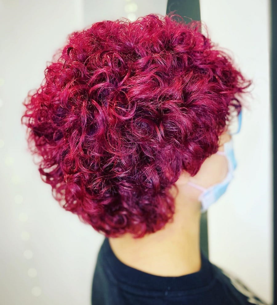 short magenta red curly hair