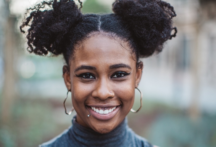 black woman with short pigtails