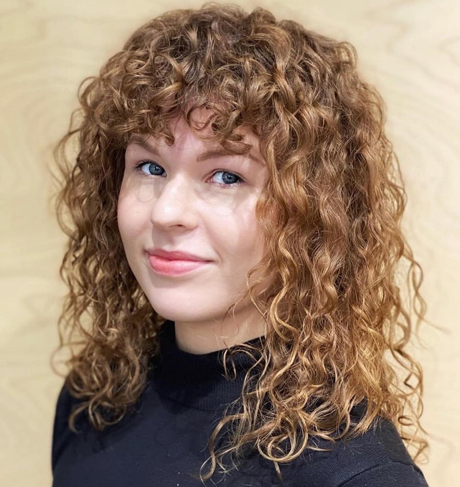 spiral perm hair with bangs