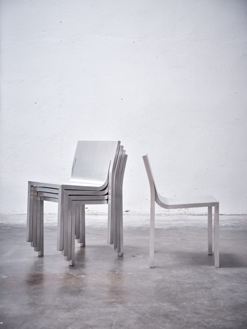 A shot of the stackable nature of the Stedelijk Chairs alongside a standalone Stedelijk Chair