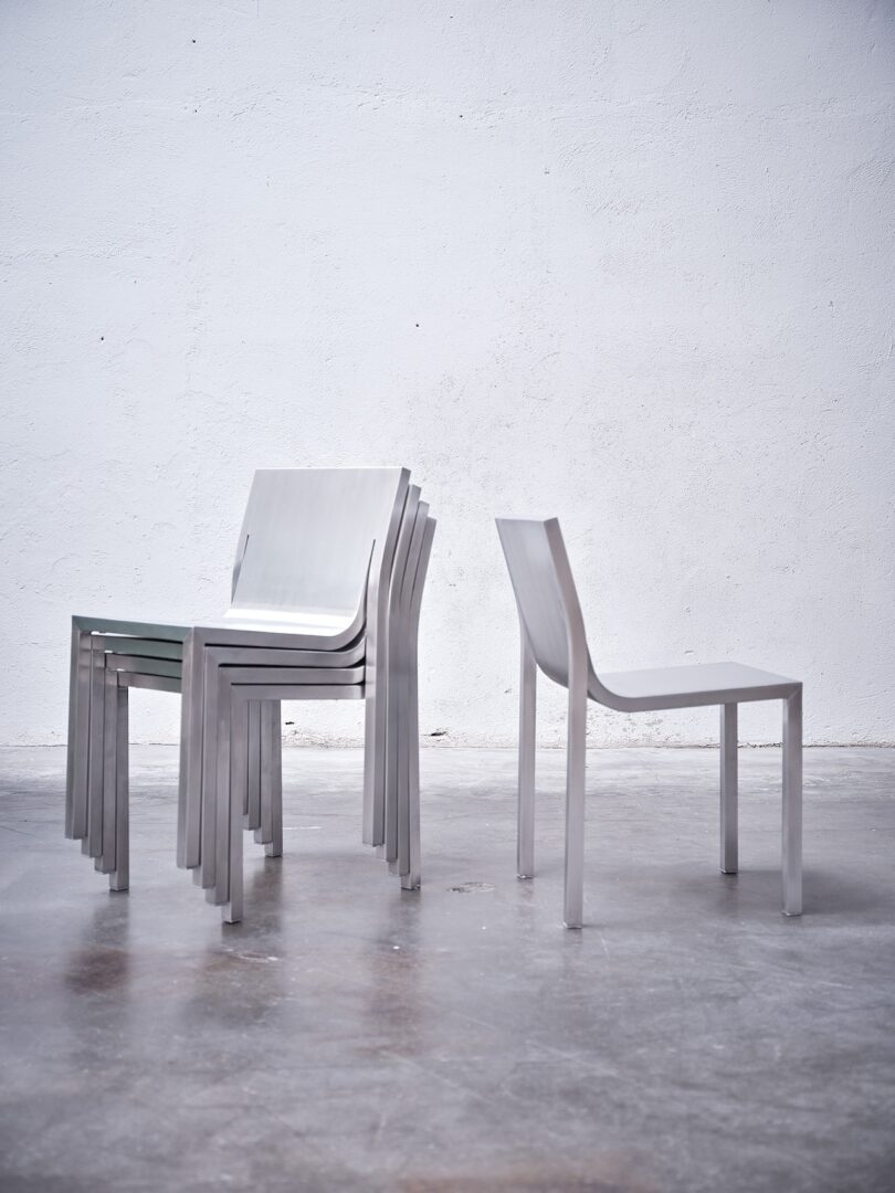 A shot of the stackable nature of the Stedelijk Chairs alongside a standalone Stedelijk Chair