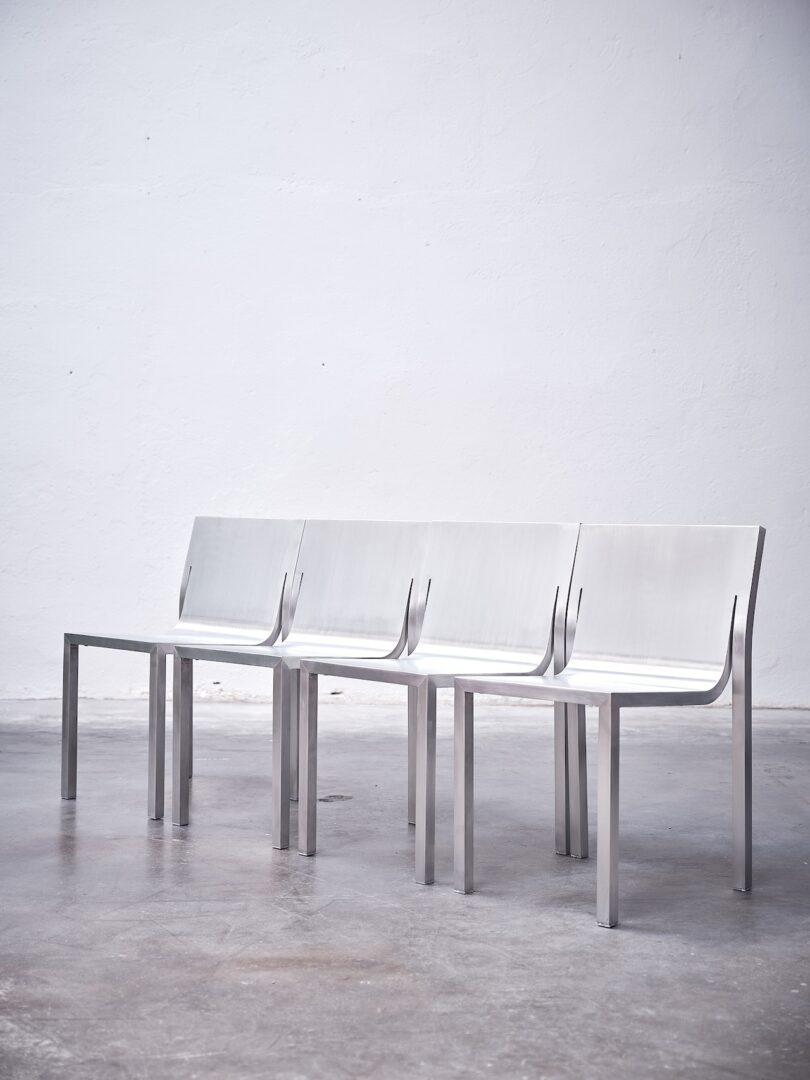 A row of Stedelijk Chairs side by side