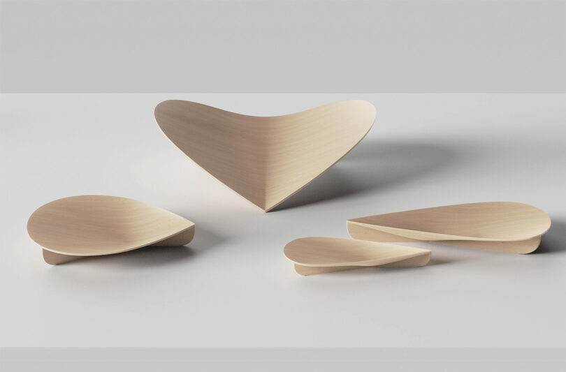 Four sizes of the wood Drop Tray displayed at varying directions.