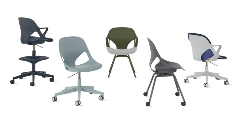 Three modern ergonomic armchairs with a white background.