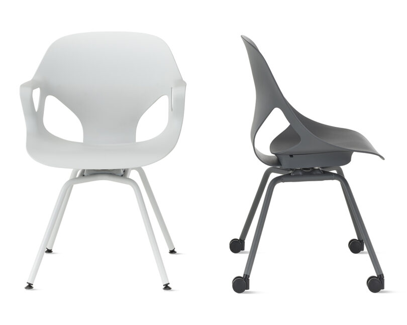 Two modern ergonomic armchairs with a white background.