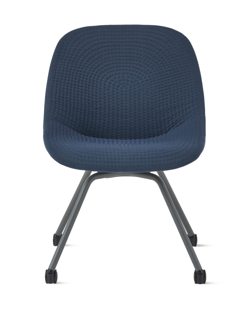 Blue modern office chair with textured upholstery and metallic legs on wheels, isolated on a white background.