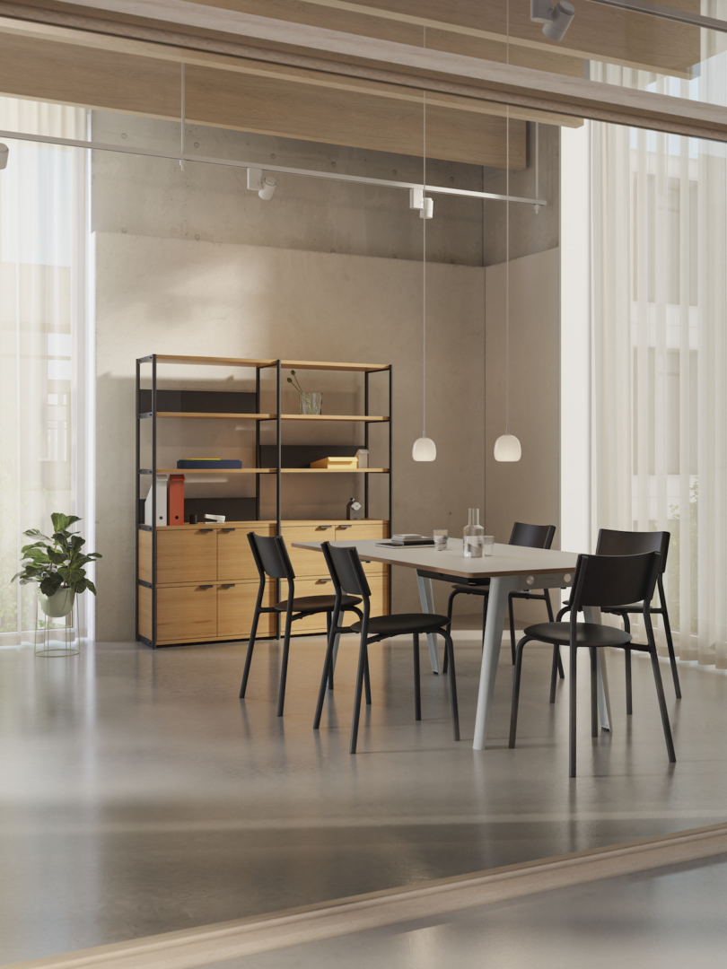 shelf next to a white table and black chairs